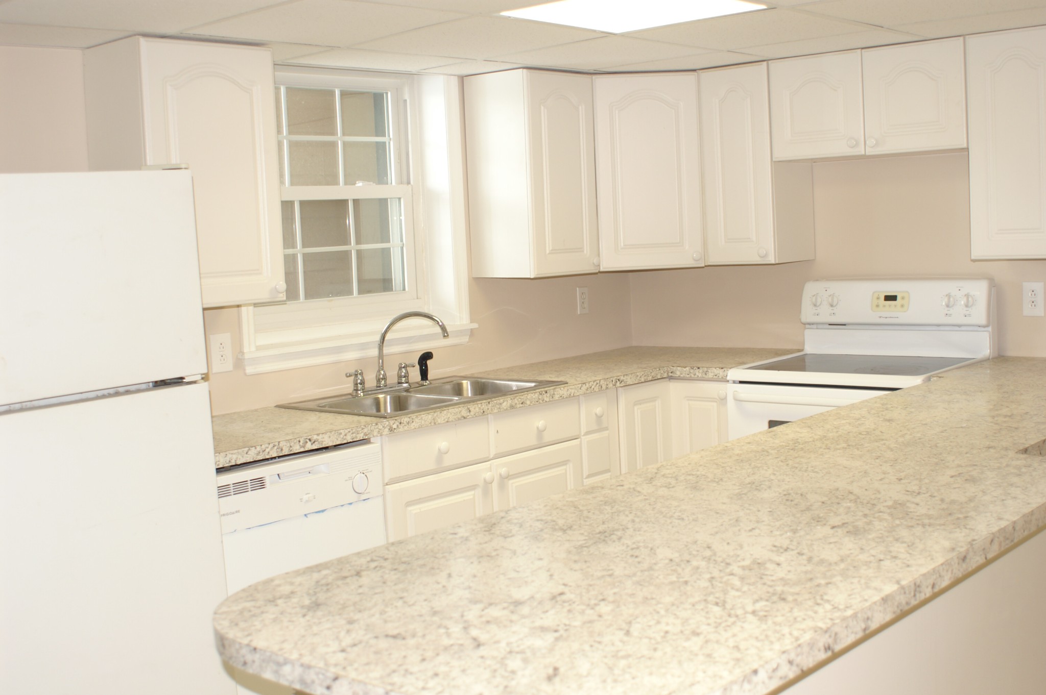 4765 Hickory Ridge Road Lebanon, TN 37087 - Photo 25 of 41 a kitchen with a sink a stove and white cabinets