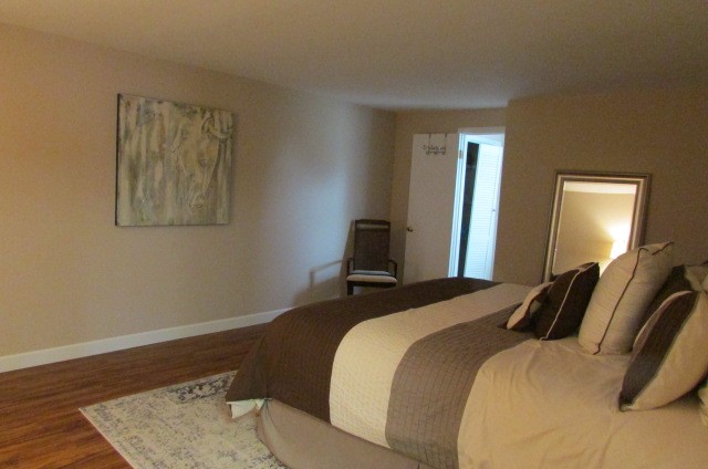 4765 Hickory Ridge Road Lebanon, TN 37087 - Photo 30 of 41 a bedroom with a bed and wooden floor