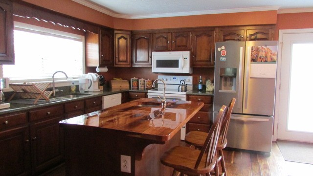 4765 Hickory Ridge Road Lebanon, TN 37087 - Photo 10 of 41 a dining table with chairs and cabinets