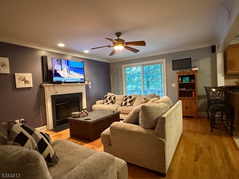 531 Harris Avenue Middlesex, NJ 08846 - Photo 12 of 19 a living room with furniture a fireplace and a flat screen tv