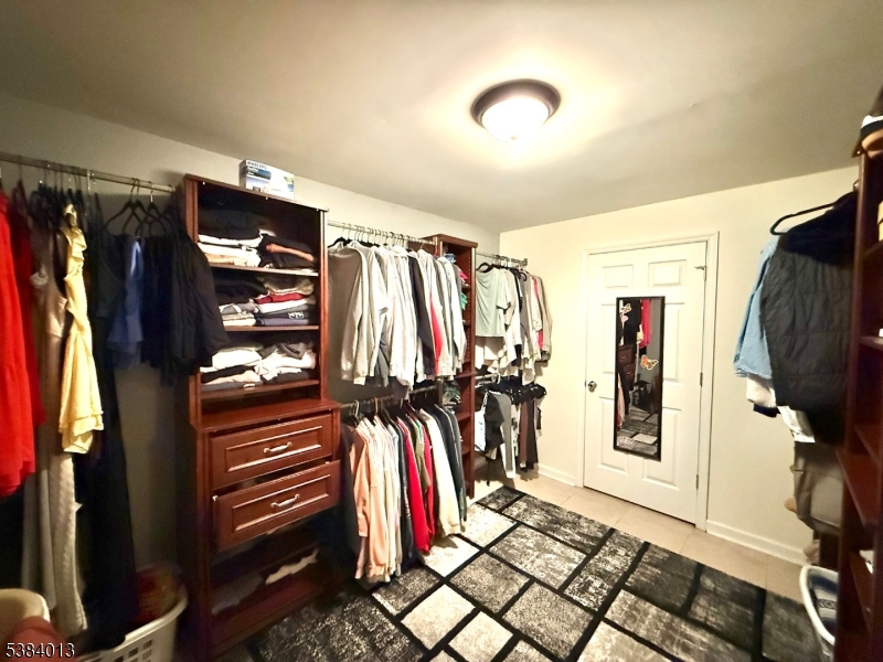 531 Harris Avenue Middlesex, NJ 08846 - Photo 15 of 19 a view of walk in closet with clothes and shoes