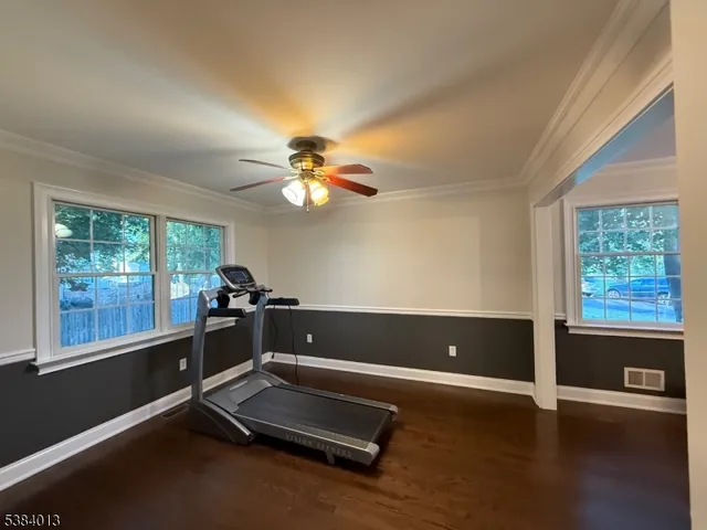 a view of room with window and wooden floor