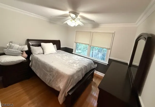 a bedroom with bed and window