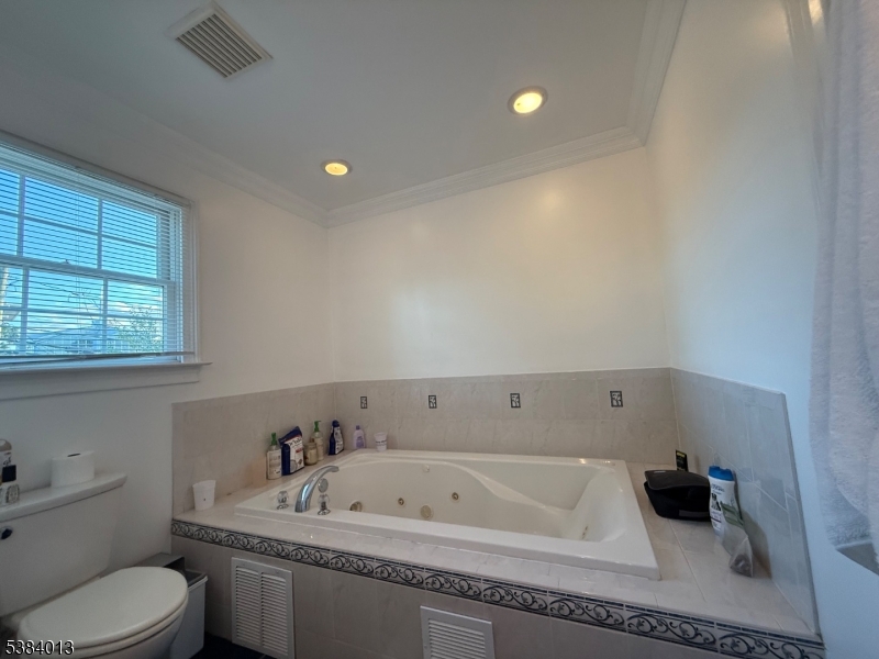 531 Harris Avenue Middlesex, NJ 08846 - Photo 19 of 19 a bathroom with a bathtub a toilet and a sink