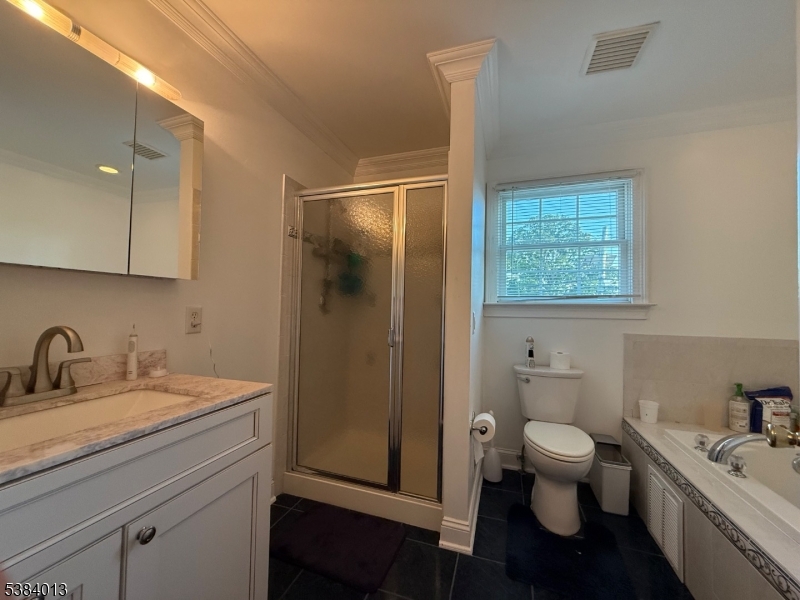 531 Harris Avenue Middlesex, NJ 08846 - Photo 3 of 19 a bathroom with a sink toilet and shower