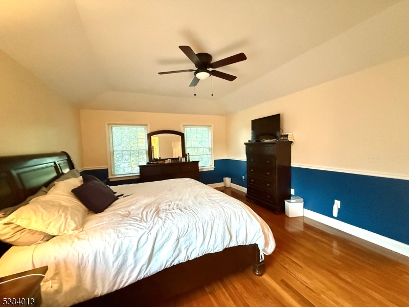531 Harris Avenue Middlesex, NJ 08846 - Photo 4 of 19 a bedroom with a bed and wooden floor