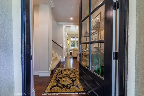 a very nice looking room with wooden floor and a rug