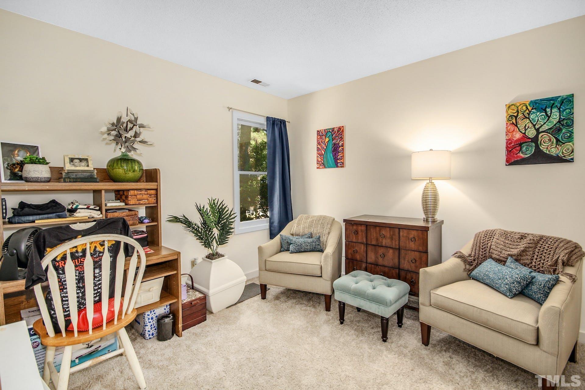 4605 Batavia Court Raleigh, NC 27604 - Photo 15 of 18 a bedroom with furniture and a couch