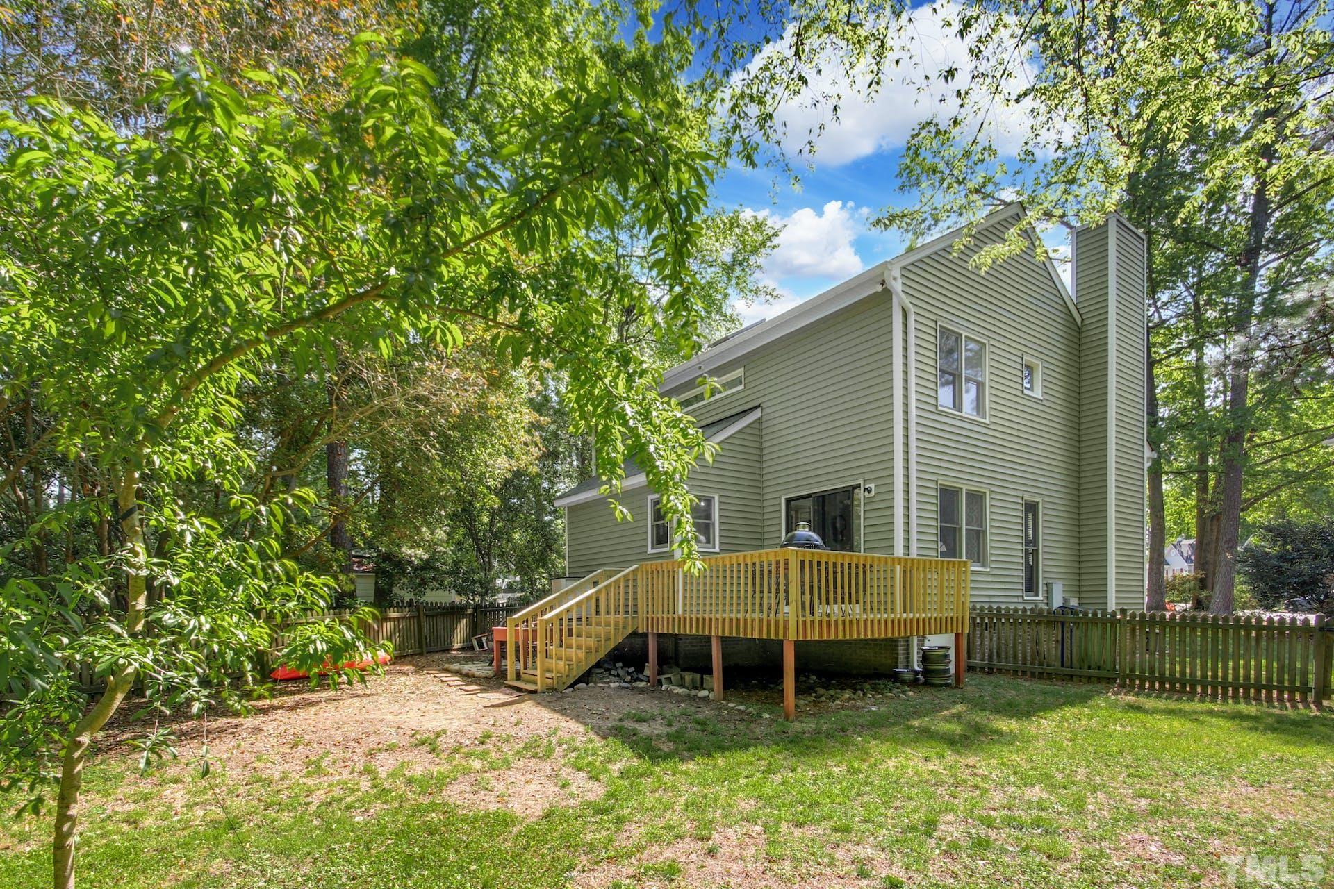 4605 Batavia Court Raleigh, NC 27604 - Photo 17 of 18 a backyard of a house with yard and outdoor seating