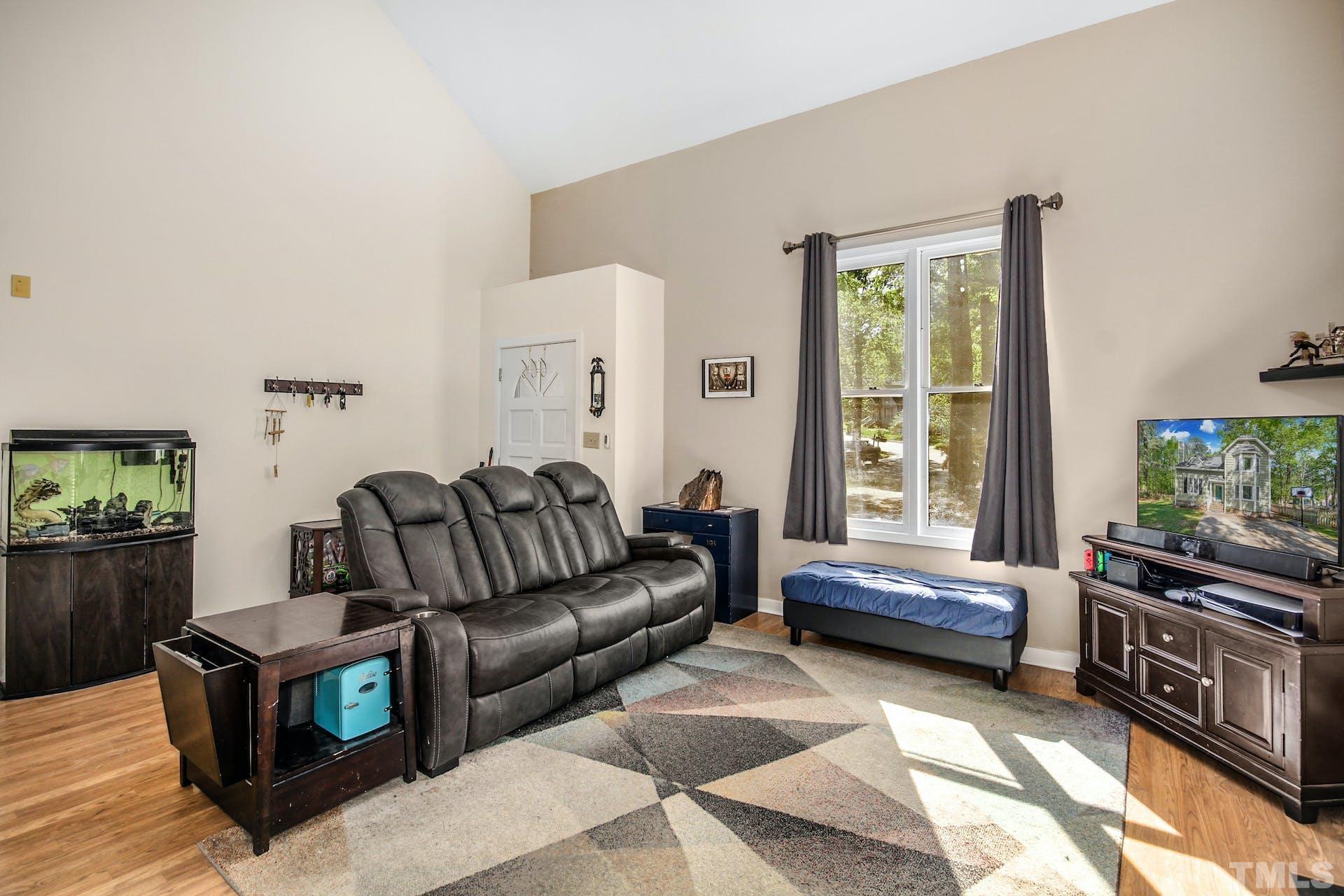 4605 Batavia Court Raleigh, NC 27604 - Photo 2 of 18 a living room with furniture and a window