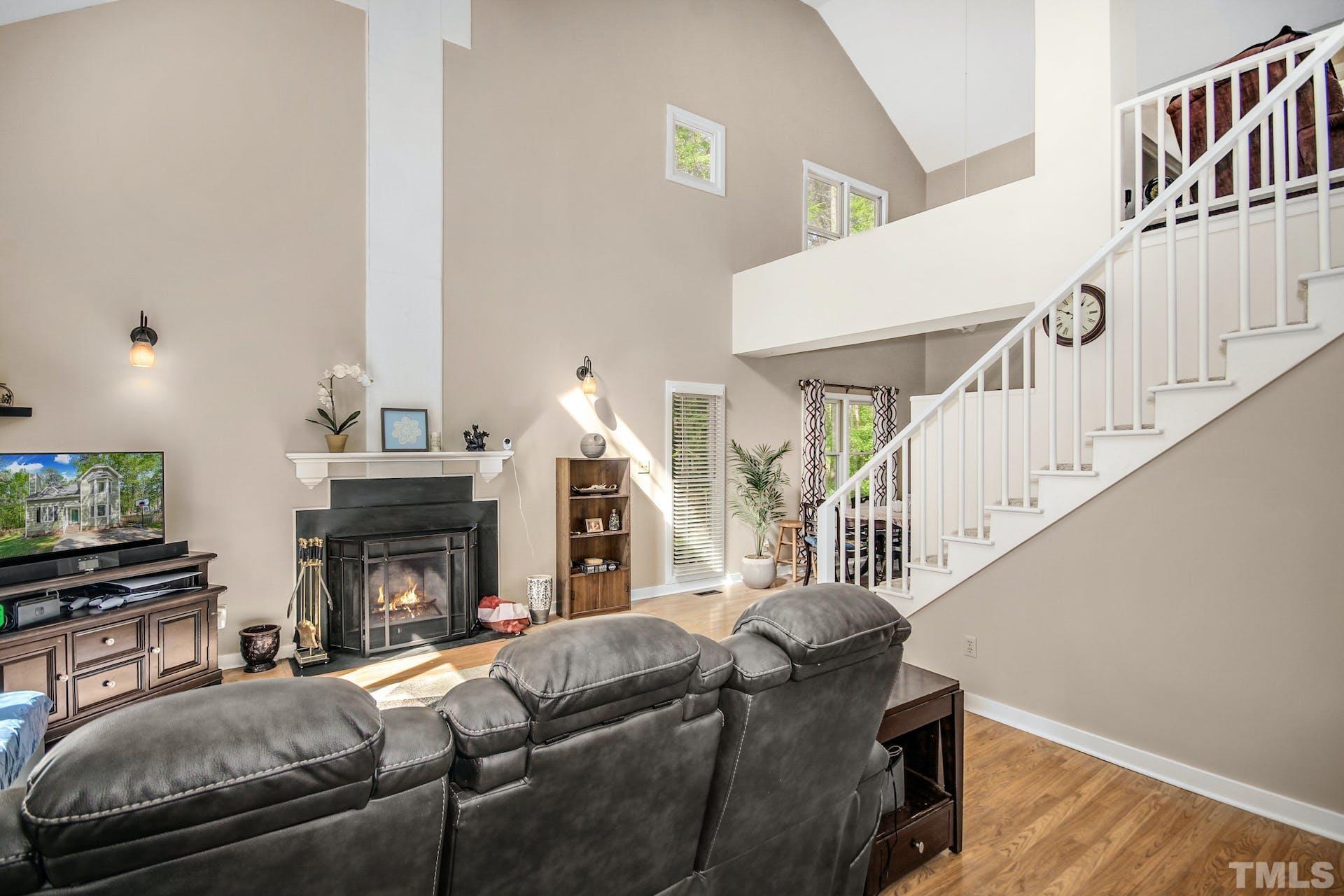 4605 Batavia Court Raleigh, NC 27604 - Photo 3 of 18 a living room with furniture and a fireplace