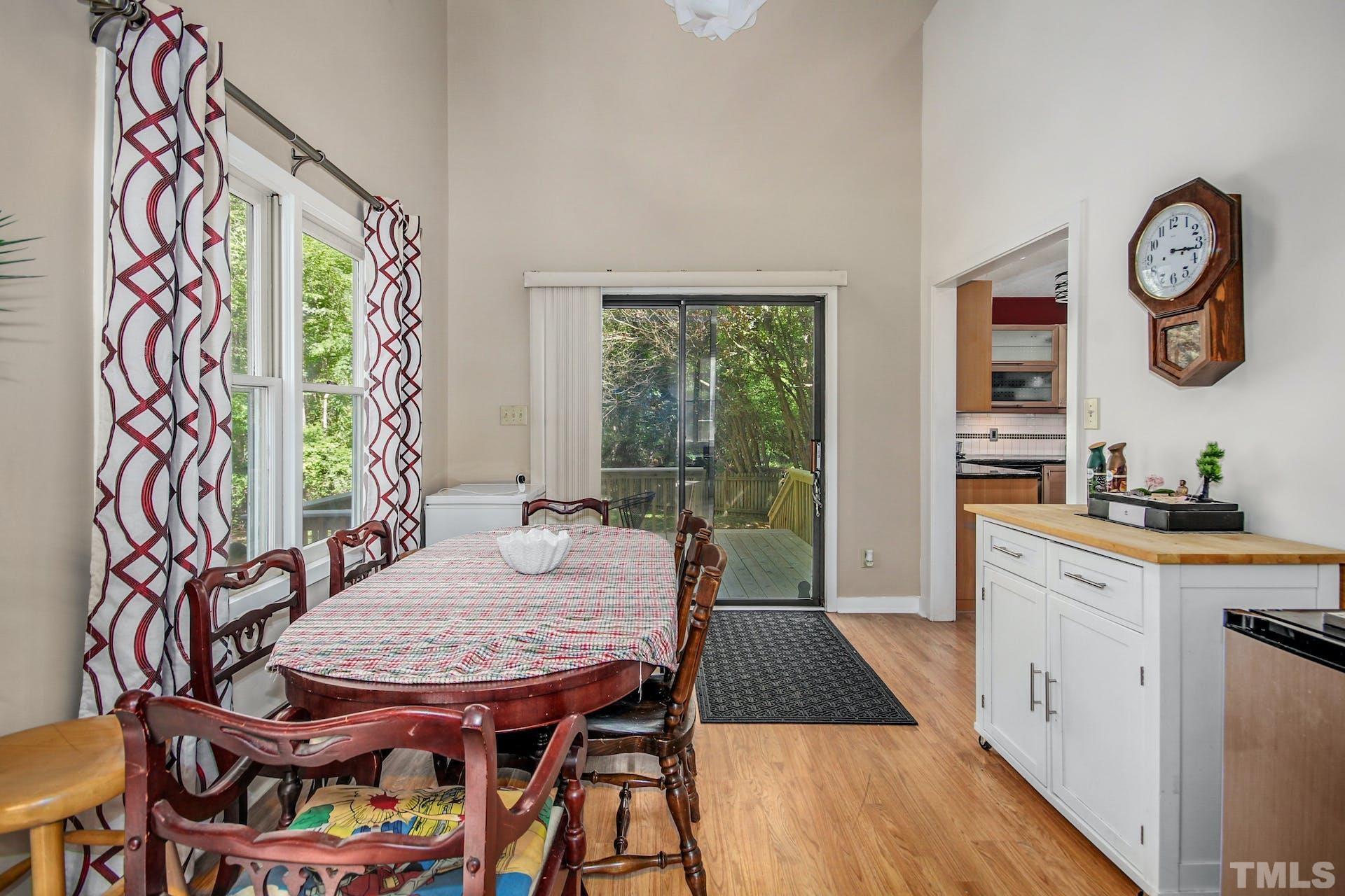4605 Batavia Court Raleigh, NC 27604 - Photo 5 of 18 a view of a dining room with furniture window and wooden floor