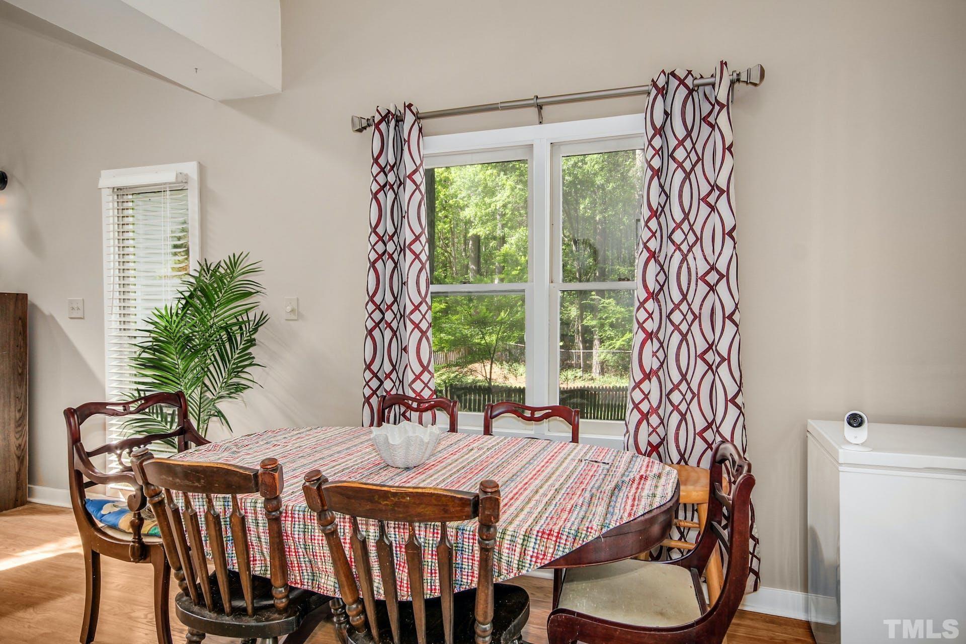 4605 Batavia Court Raleigh, NC 27604 - Photo 6 of 18 a bedroom with a bed and a window