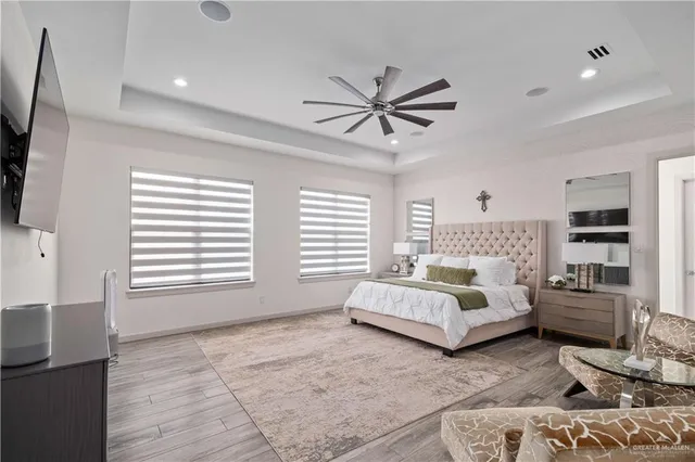 a bathroom with a bathtub shower sink and mirror