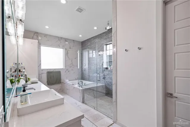 a bathroom with a double vanity sink mirror and double