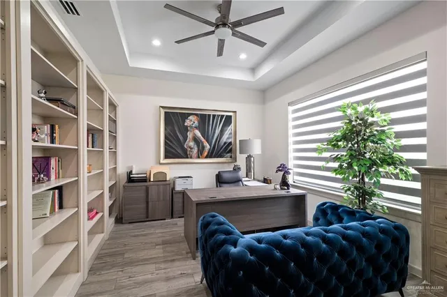 a spacious bedroom with a bed couch and a window
