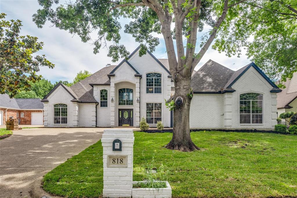 818 Riviera Drive Mansfield, TX 76063 - Photo 1 of 24 White brick exterior with a dark shingle roof and contrasting dark trim