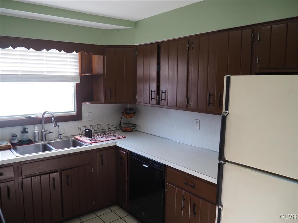 147 Williams Road Cresco, PA 18326 - Photo 11 of 35 a kitchen with a sink and a refrigerator