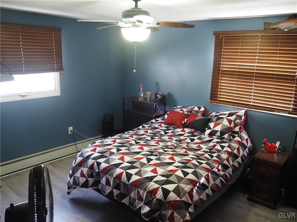 147 Williams Road Cresco, PA 18326 - Photo 12 of 35 a bed sitting in a bedroom next to a window