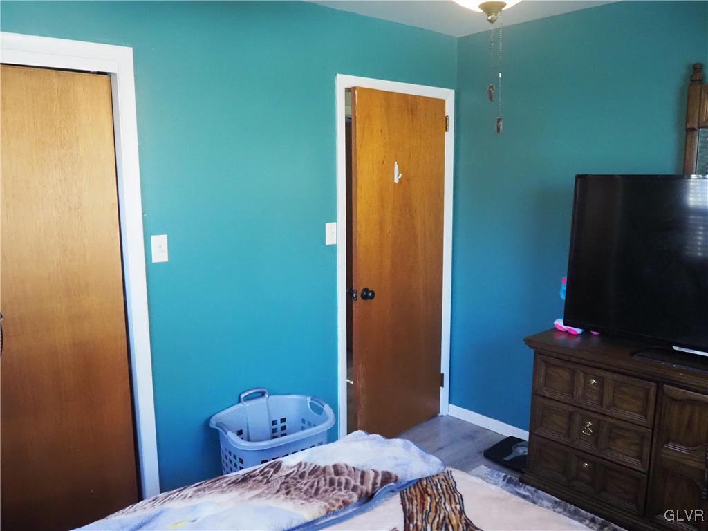 147 Williams Road Cresco, PA 18326 - Photo 18 of 35 a bedroom with a bed and a flat screen tv