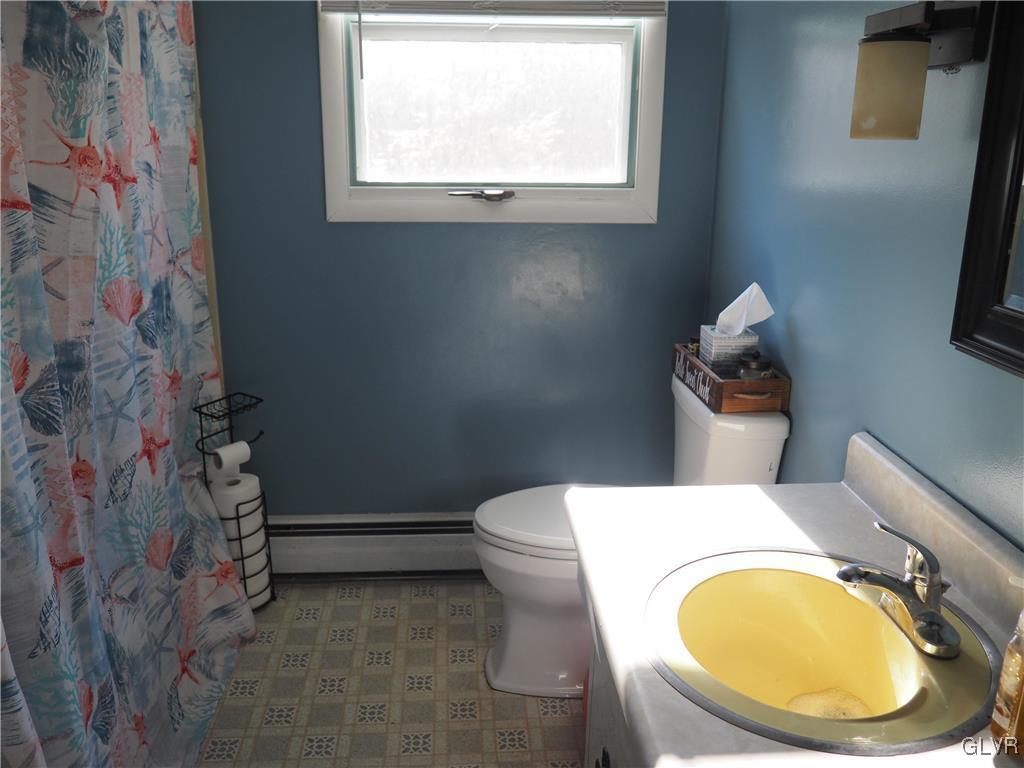 147 Williams Road Cresco, PA 18326 - Photo 21 of 35 a bathroom with a toilet and a sink