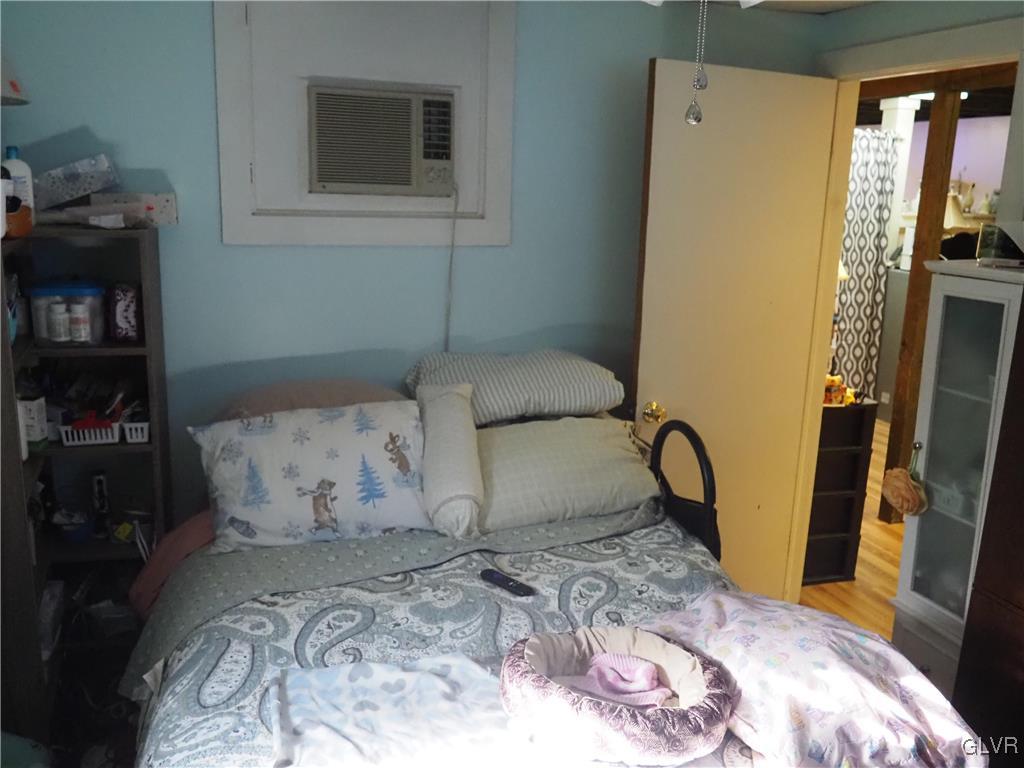 147 Williams Road Cresco, PA 18326 - Photo 27 of 35 a bedroom with a bed and wooden floor