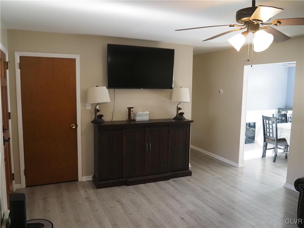 147 Williams Road Cresco, PA 18326 - Photo 7 of 35 a living room with a flat screen tv and kitchen view