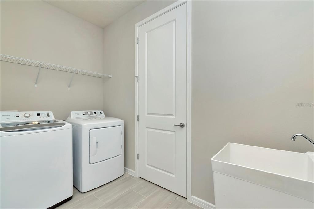 1991 Spring Shower Circle Kissimmee, FL 34744 - Photo 29 of 51 a utility room with dryer and washer