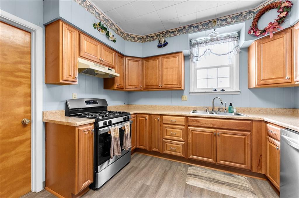 1738-1740 Hancock Avenue Apollo, PA 15613 - Photo 19 of 49 a kitchen with stainless steel appliances granite countertop a stove and a sink