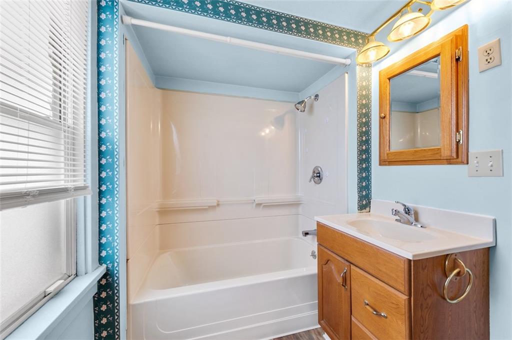 1738-1740 Hancock Avenue Apollo, PA 15613 - Photo 29 of 49 a bathroom with a sink a mirror and a bathtub