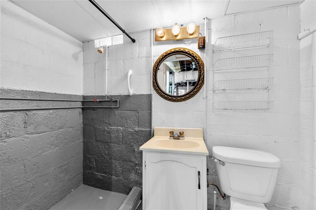 1738-1740 Hancock Avenue Apollo, PA 15613 - Photo 37 of 49 a bathroom with a sink a toilet and a shower