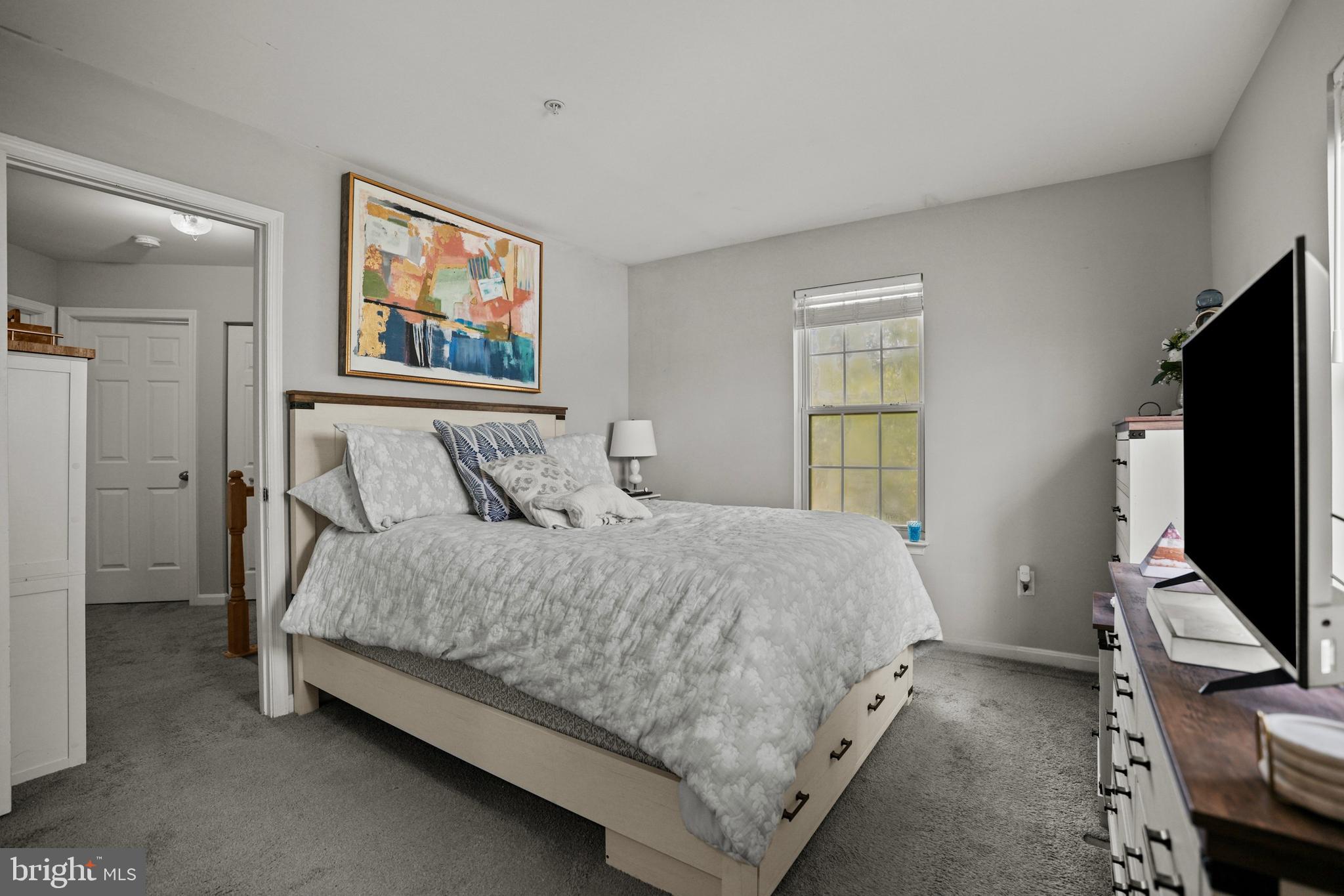 3915 Red Deer Circle Randallstown, MD 21133 - Photo 12 of 30 a bedroom with a bed and a flat screen tv