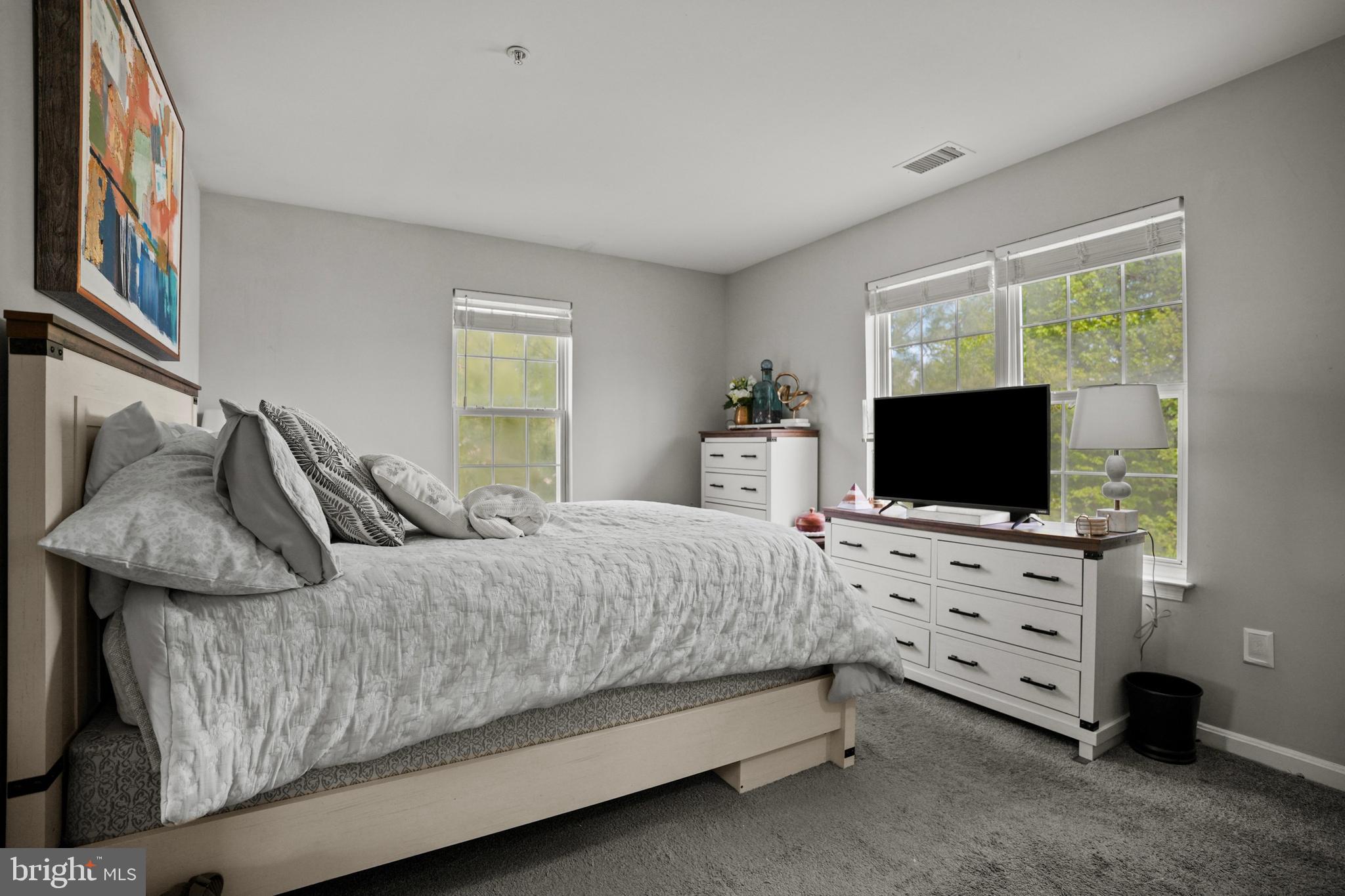 3915 Red Deer Circle Randallstown, MD 21133 - Photo 13 of 30 a bedroom with a bed and a flat screen tv