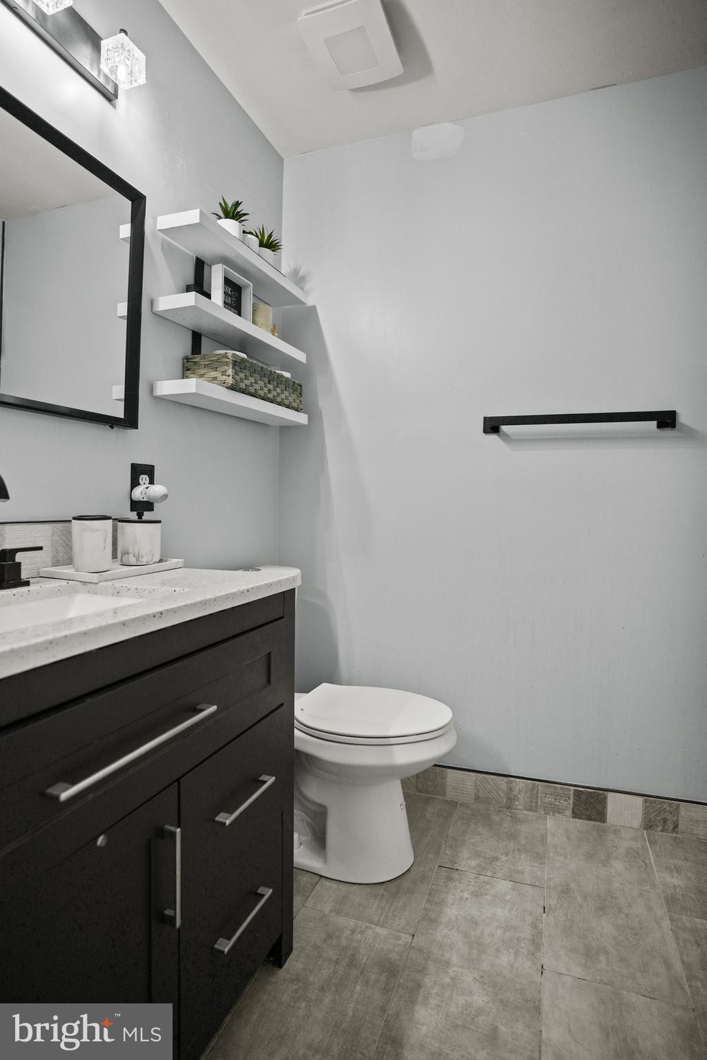 3915 Red Deer Circle Randallstown, MD 21133 - Photo 15 of 30 a bathroom with a sink a toilet and mirror