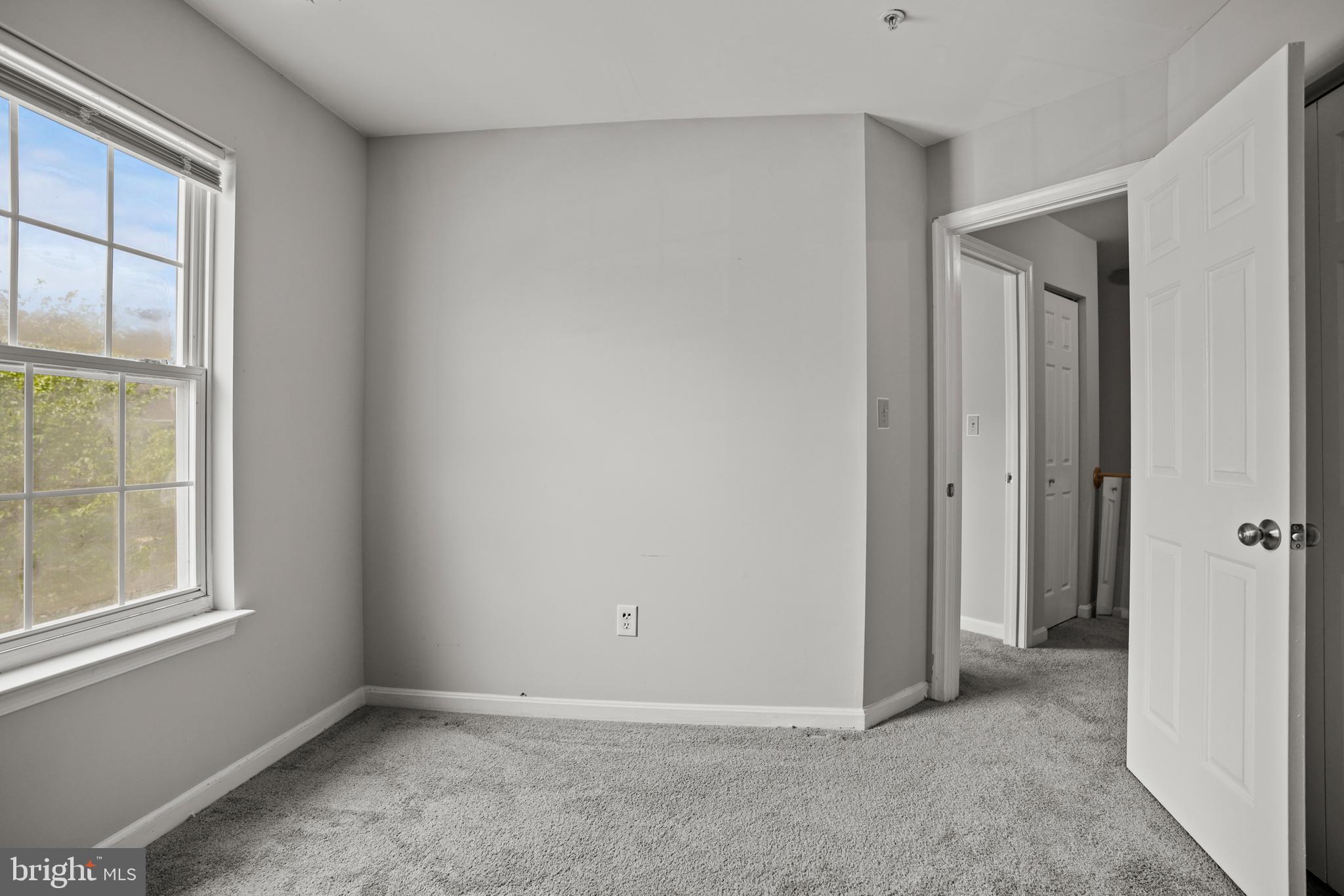 3915 Red Deer Circle Randallstown, MD 21133 - Photo 18 of 30 an empty room with windows and closet
