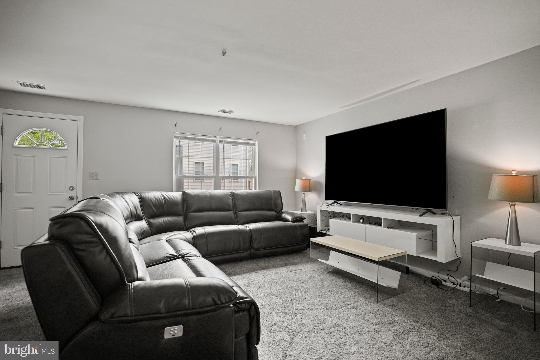3915 Red Deer Circle Randallstown, MD 21133 - Photo 20 of 30 a living room with furniture and a flat screen tv