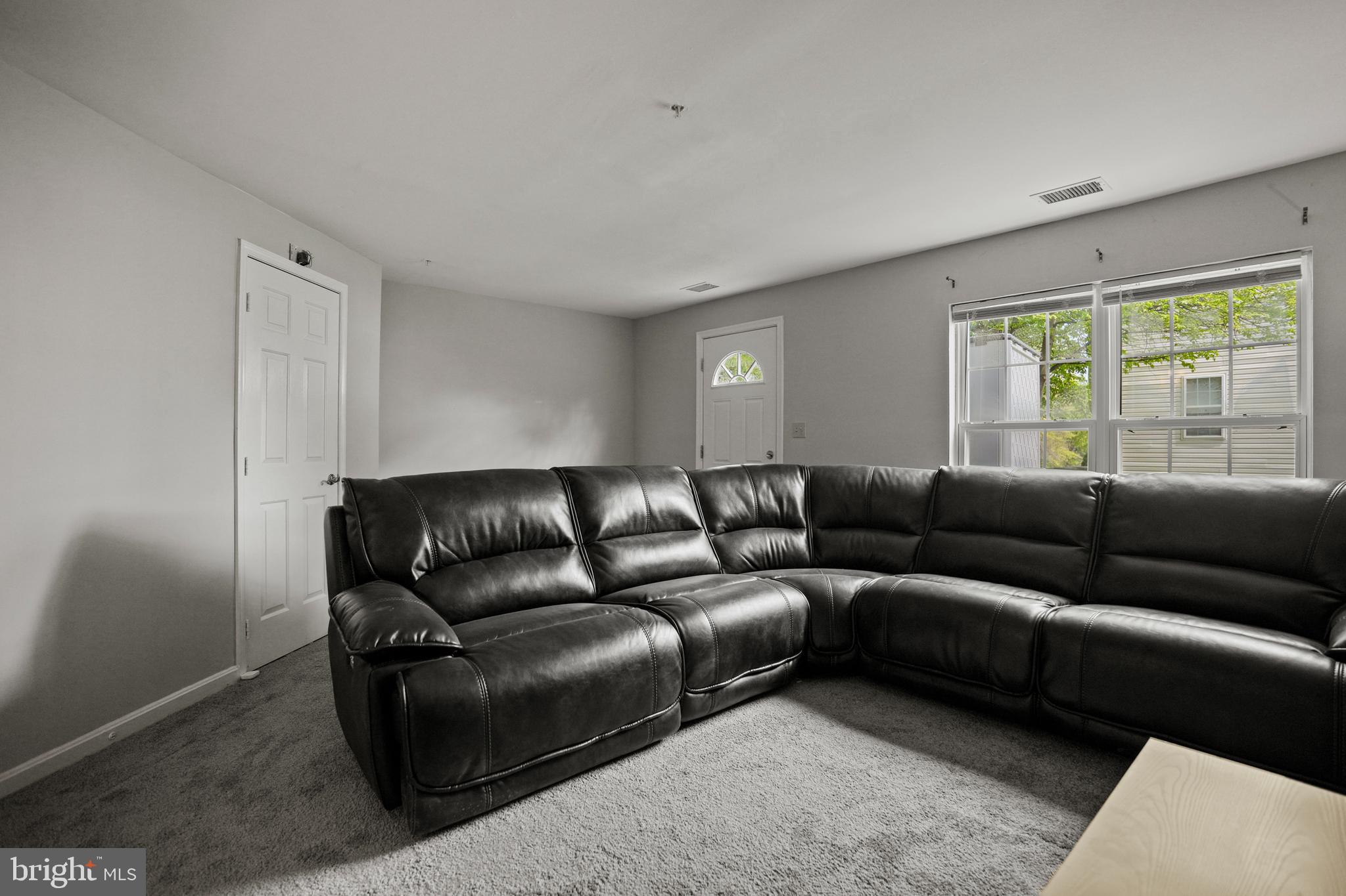 3915 Red Deer Circle Randallstown, MD 21133 - Photo 22 of 30 a living room with furniture and a large window