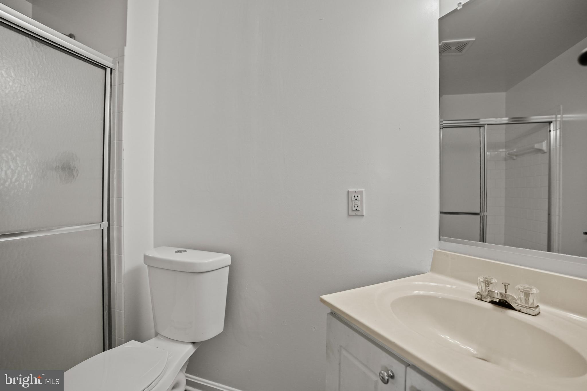 3915 Red Deer Circle Randallstown, MD 21133 - Photo 23 of 30 a bathroom with a sink toilet and vanity