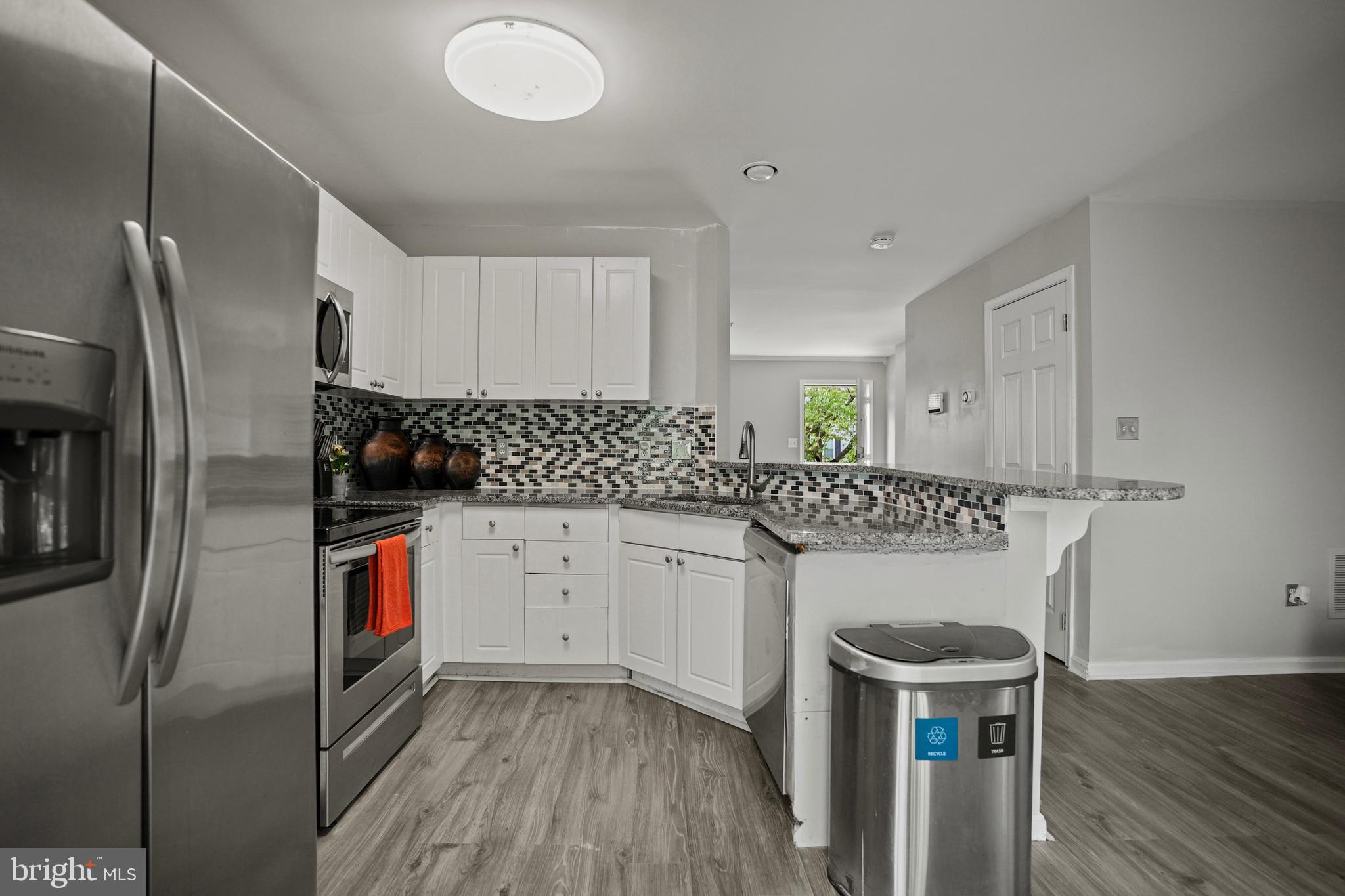 3915 Red Deer Circle Randallstown, MD 21133 - Photo 9 of 30 a kitchen with a refrigerator and a sink