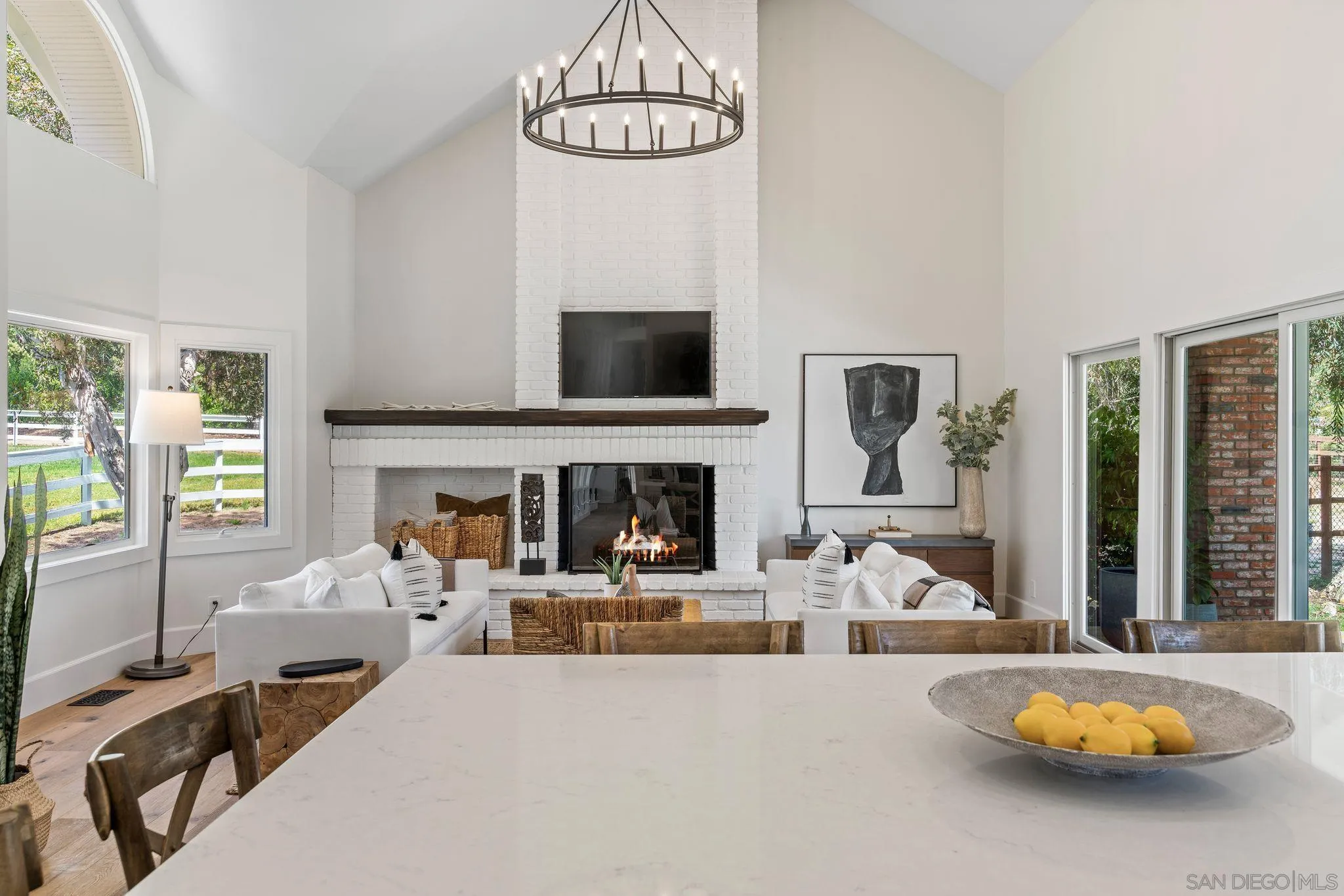 3355 Dove Hollow Road Encinitas, CA 92024 - Photo 12 of 37 a living room with furniture and a fireplace