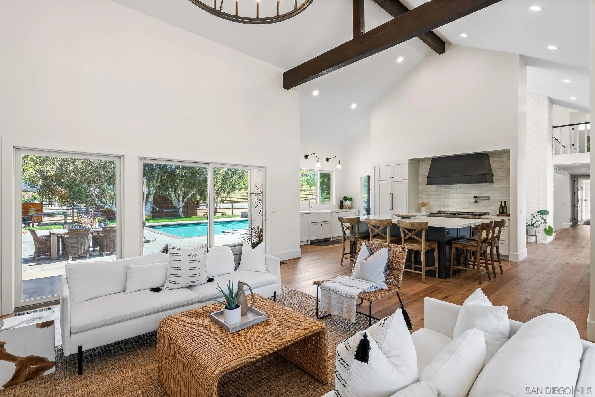3355 Dove Hollow Road Encinitas, CA 92024 - Photo 14 of 37 a living room with furniture and a flat screen tv