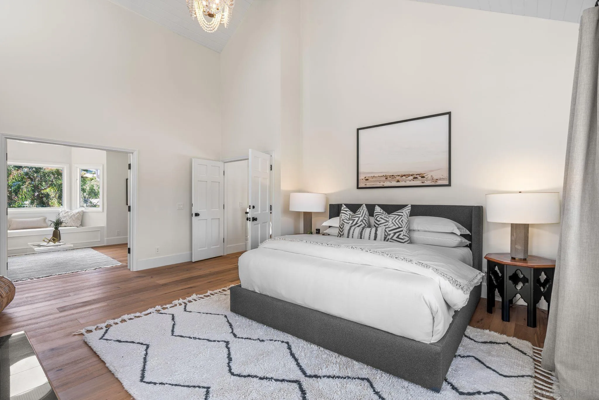 3355 Dove Hollow Road Encinitas, CA 92024 - Photo 16 of 37 a bedroom with a bed and a lamp on table