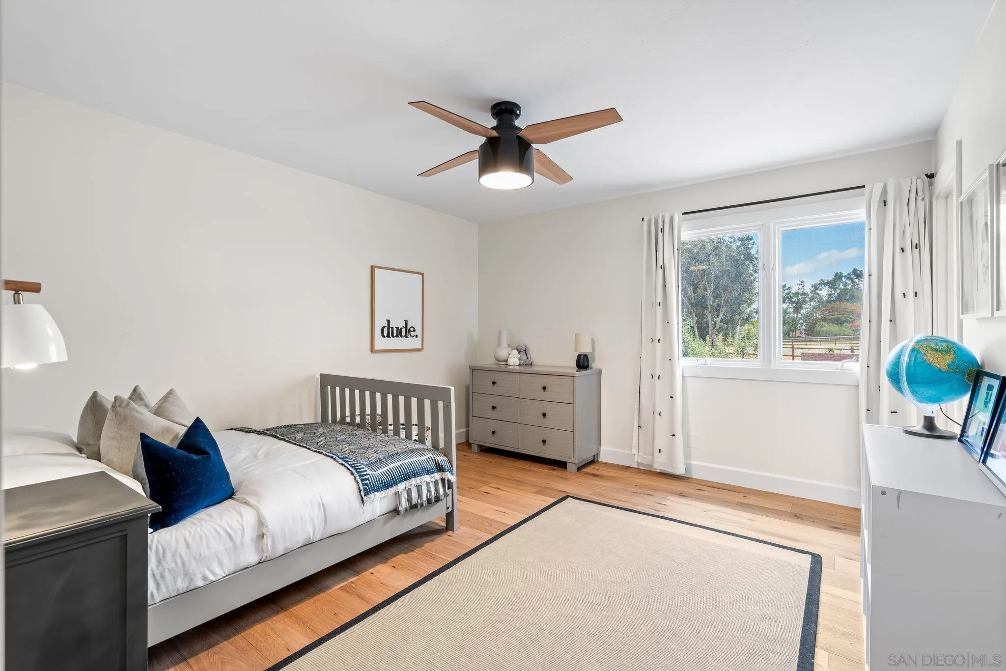 3355 Dove Hollow Road Encinitas, CA 92024 - Photo 21 of 37 a bedroom with a bed and a window