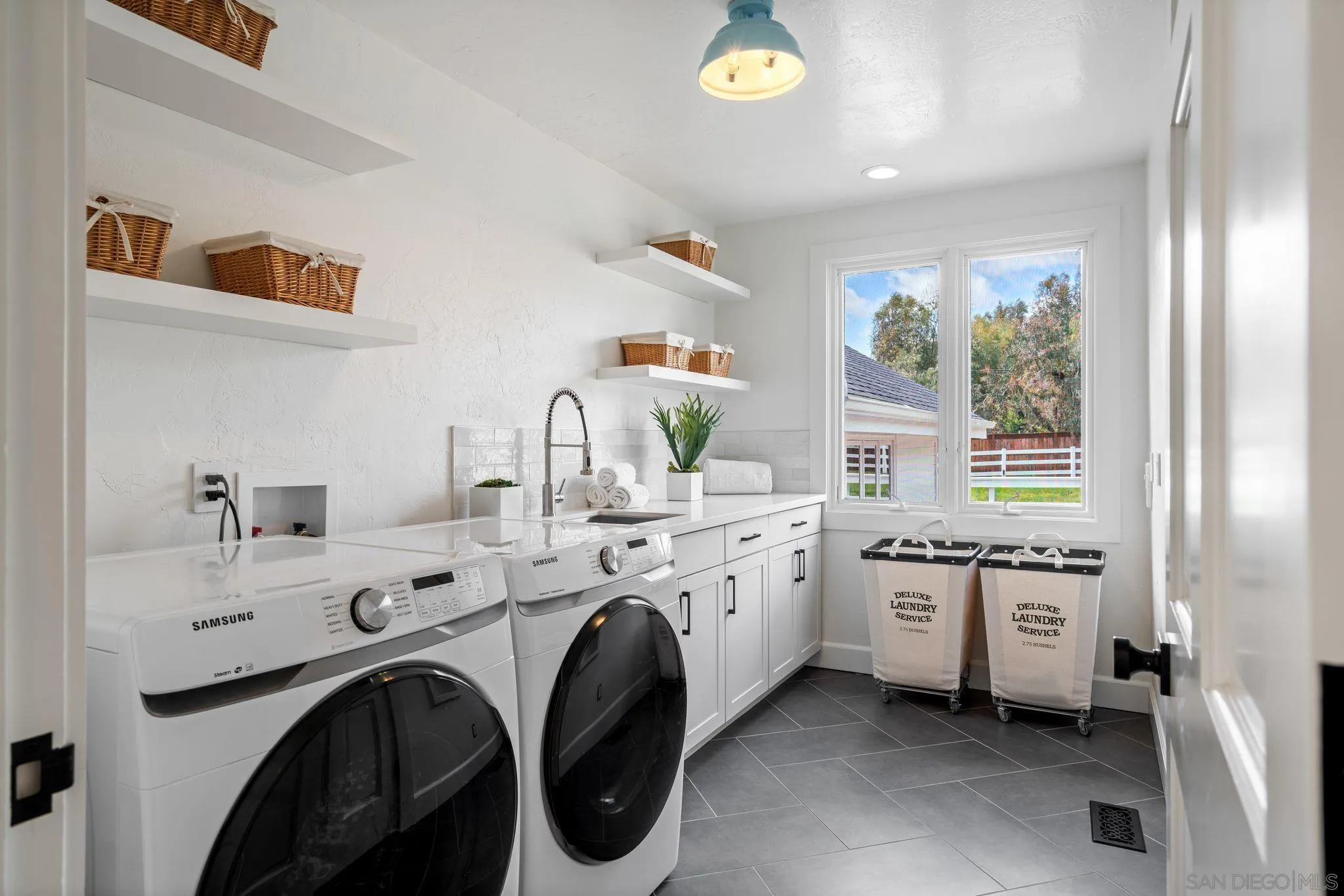 3355 Dove Hollow Road Encinitas, CA 92024 - Photo 25 of 37 a utility room with sink dryer and washer