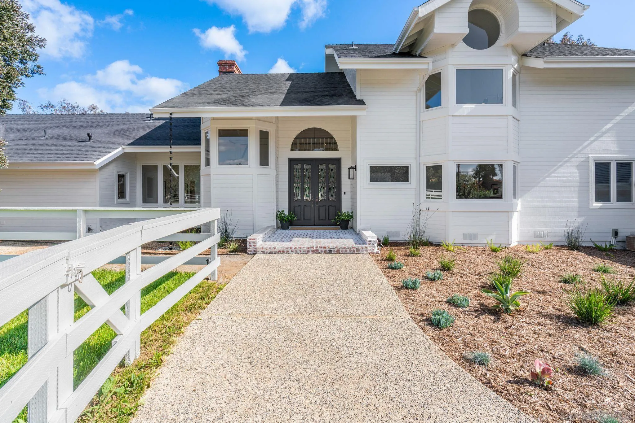 3355 Dove Hollow Road Encinitas, CA 92024 - Photo 3 of 37 a front view of a house with a yard