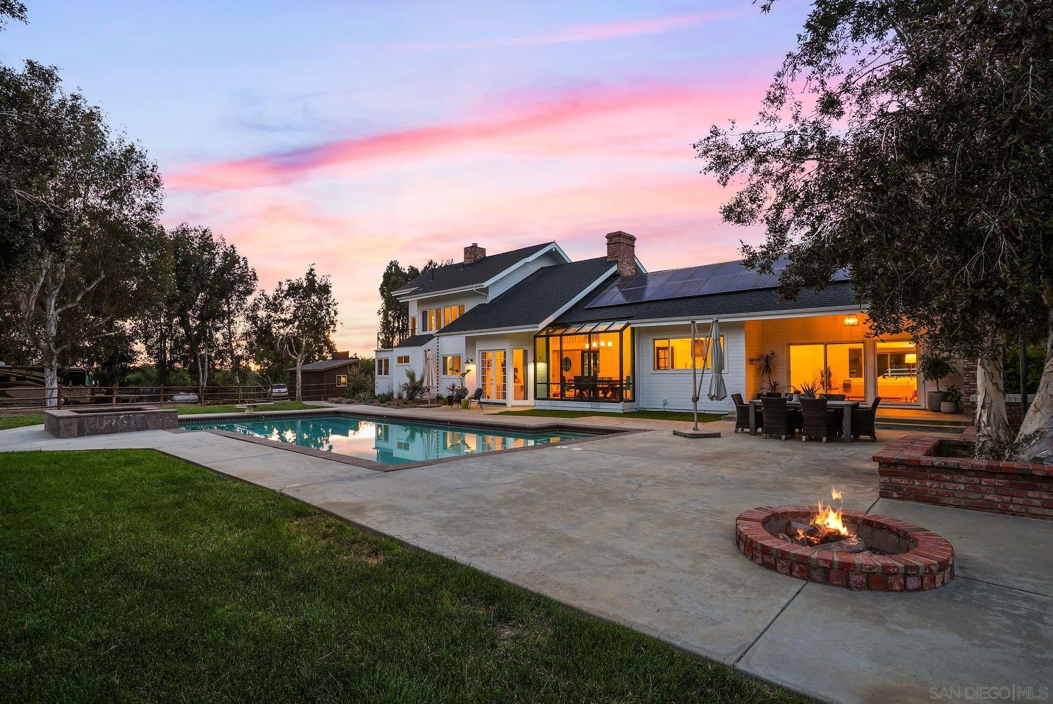 3355 Dove Hollow Road Encinitas, CA 92024 - Photo 31 of 37 a view of a house with swimming pool and a trees