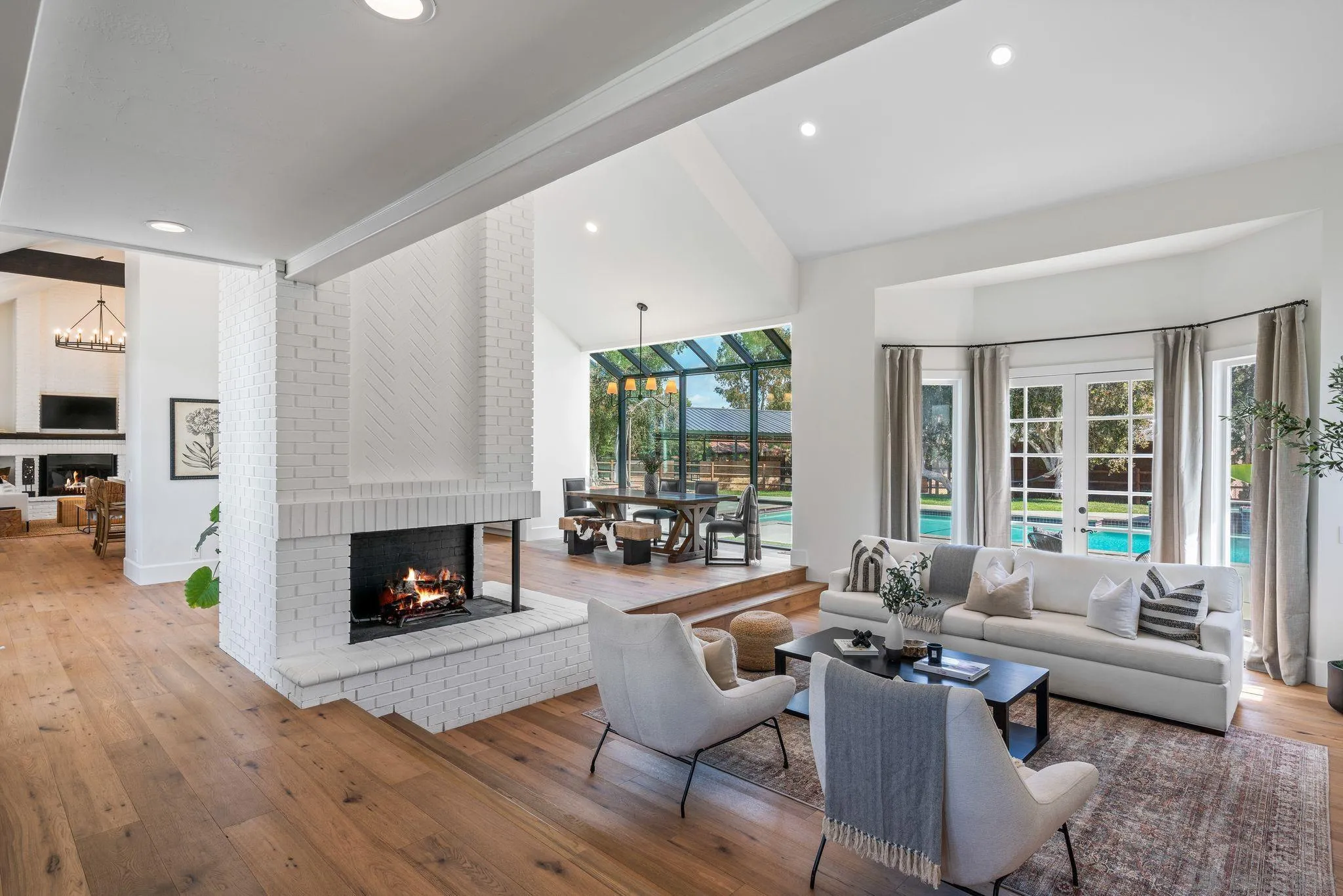3355 Dove Hollow Road Encinitas, CA 92024 - Photo 7 of 37 a living room with furniture fireplace and a table