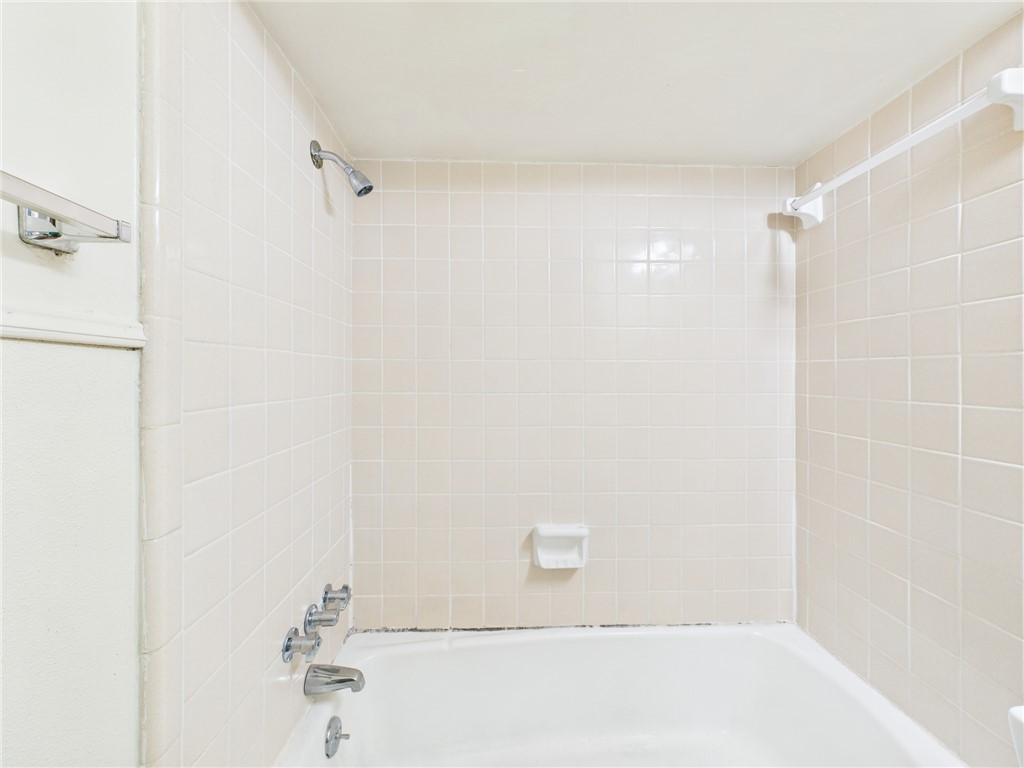 308 Ehlinger Drive, Unit C Bryan, TX 77801 - Photo 11 of 15 a bathroom with a shower