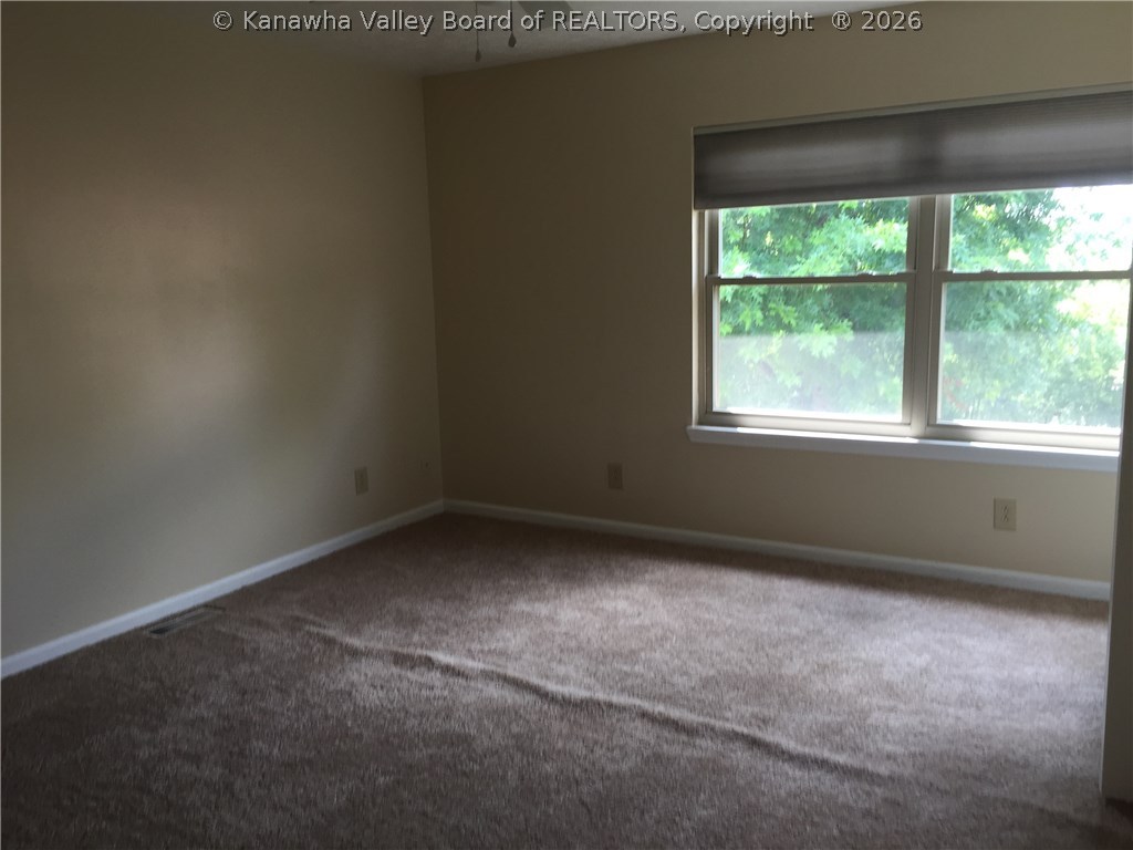 403 Powderhorn Road Charleston, WV 25314 - Photo 13 of 21 carpeted master bedroom. carpet has now been stretched.