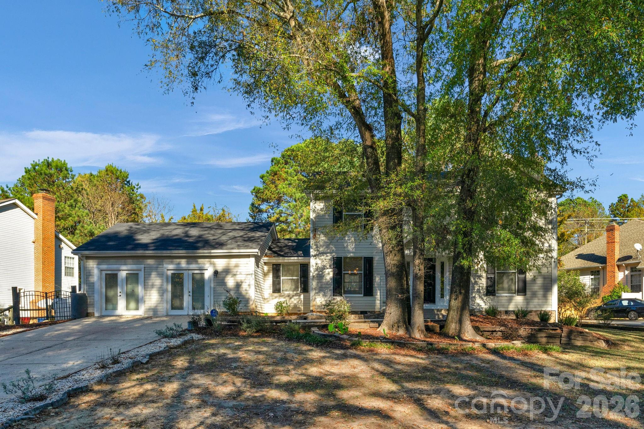 12006 Woodside Falls Road Pineville, NC 28134 - Photo 2 of 48 a front view of a house with a yard